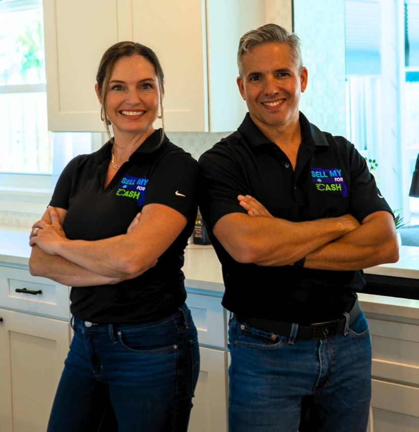 Juan & Castilia – Owners of Sell My House For Cash Florida Juan and Castilia standing together in a kitchen, the team behind Sell My House For Cash Florida